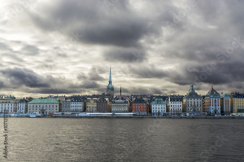 Canvas Print Silhouettes of houses on the waterfront Stockholm, dramatic cloudy sky