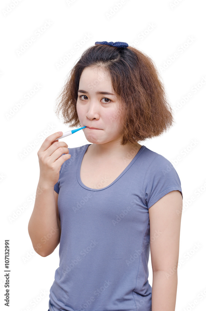 Young Asian woman with thermometer in mouth over white Young Asian woman with thermometer in mouth over white