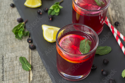 berry lemonade, refreshing summer beverage on a dark background