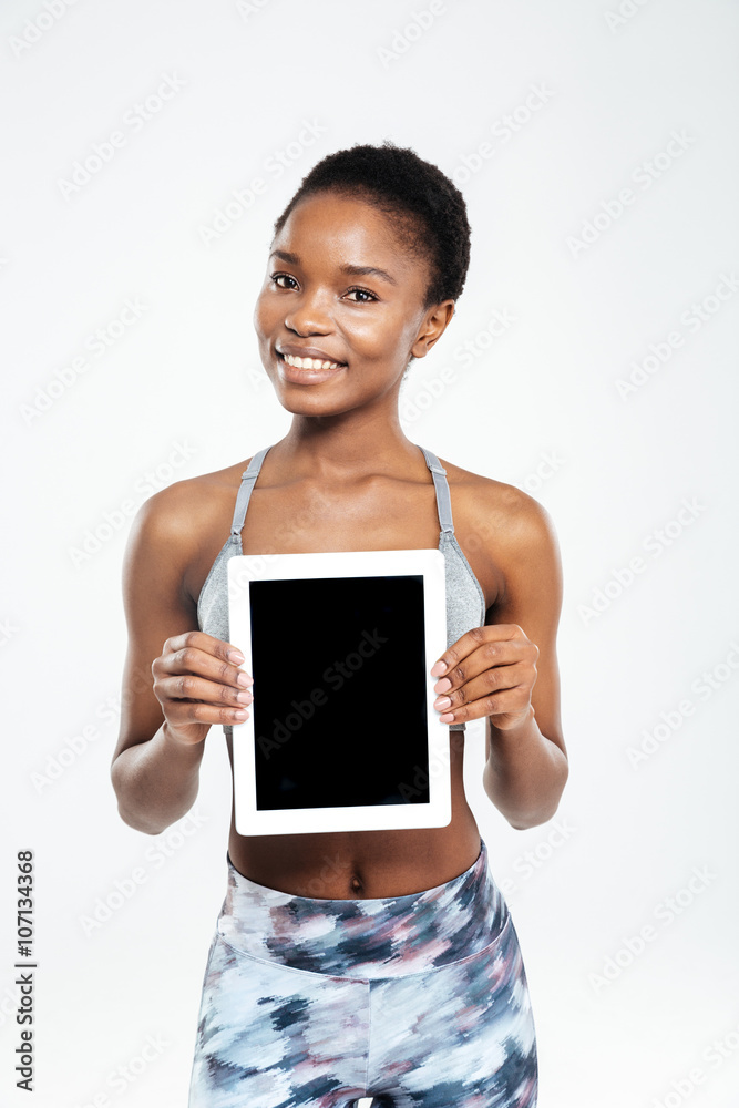 Afro american woman showing blank tablet computer screen Afro american woman showing blank tablet computer screen