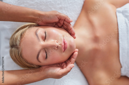 Attractive woman getting head massage at dayspa