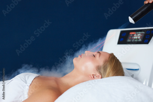 Woman receiving local cryotherapy therapy photo
