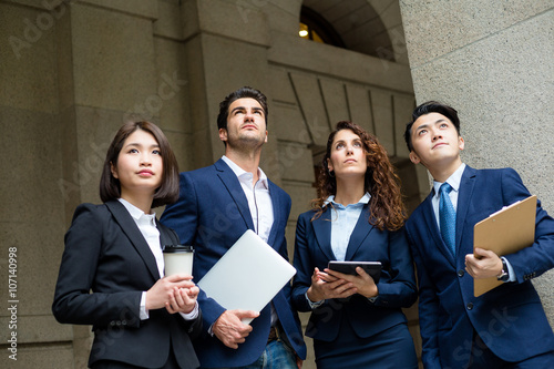 Group of business people looking together at outdoor