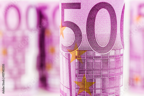 closeup view of 500 euro rolled banknote
