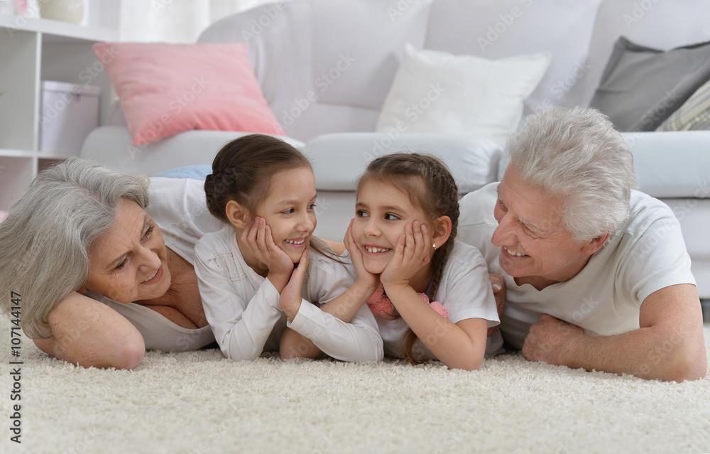 Happy senior couple with grandchildren Happy senior couple with grandchildren