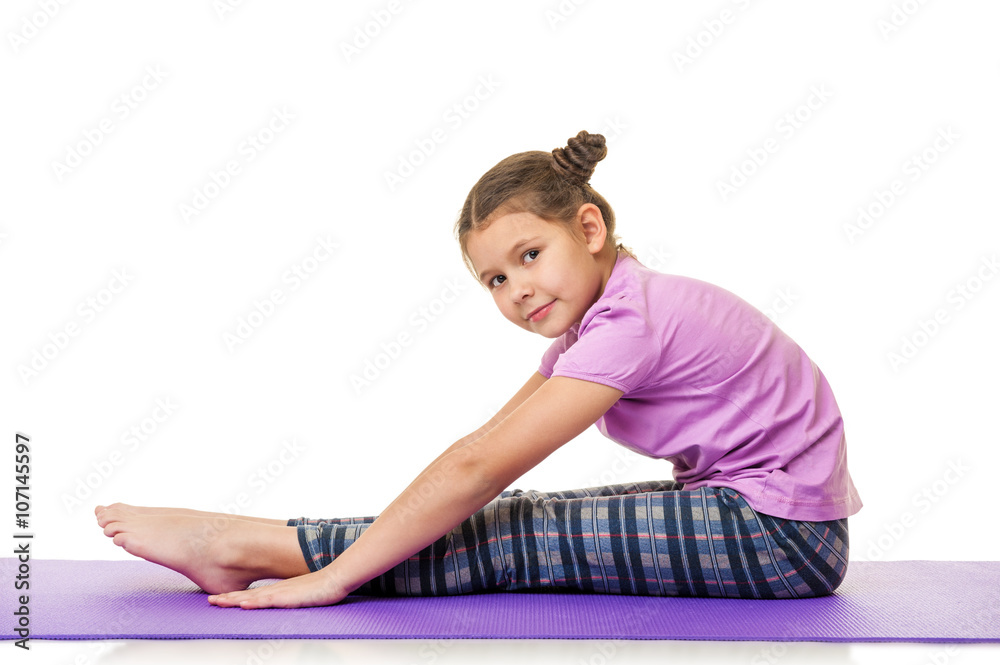 Little girl doing fitness exercises