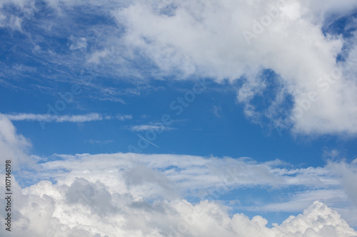 Fototapeta Naklejka Na Ścianę i Meble -  white trail from an airplane in blue sky