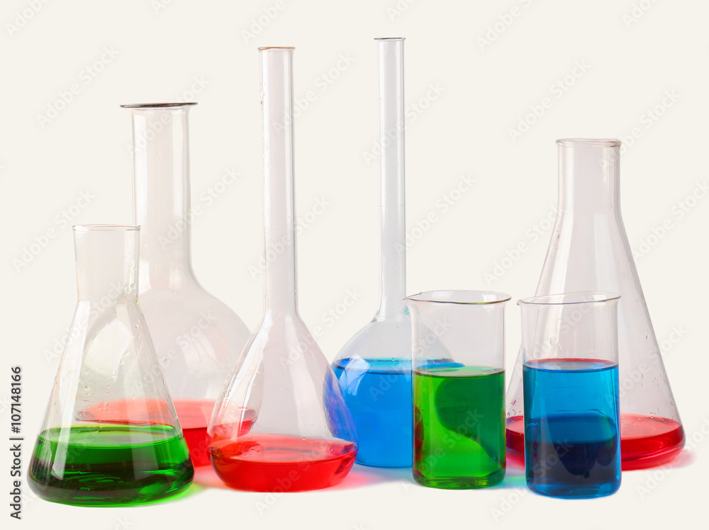 Chemical glassware with colorful liquids isolated on white background Chemical glassware with colorful liquids isolated on white background
