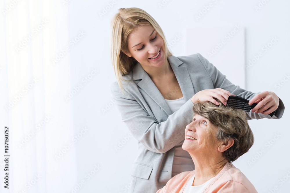 Woman take care of grandmother - obrazy, fototapety, plakaty 