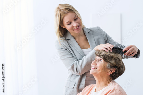 Woman take care of grandmother photo