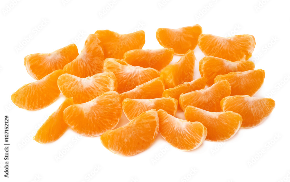 Surface covered with slice sections of tangerine isolated over the white background