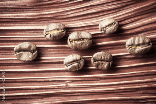 Coffee beans on wooden background