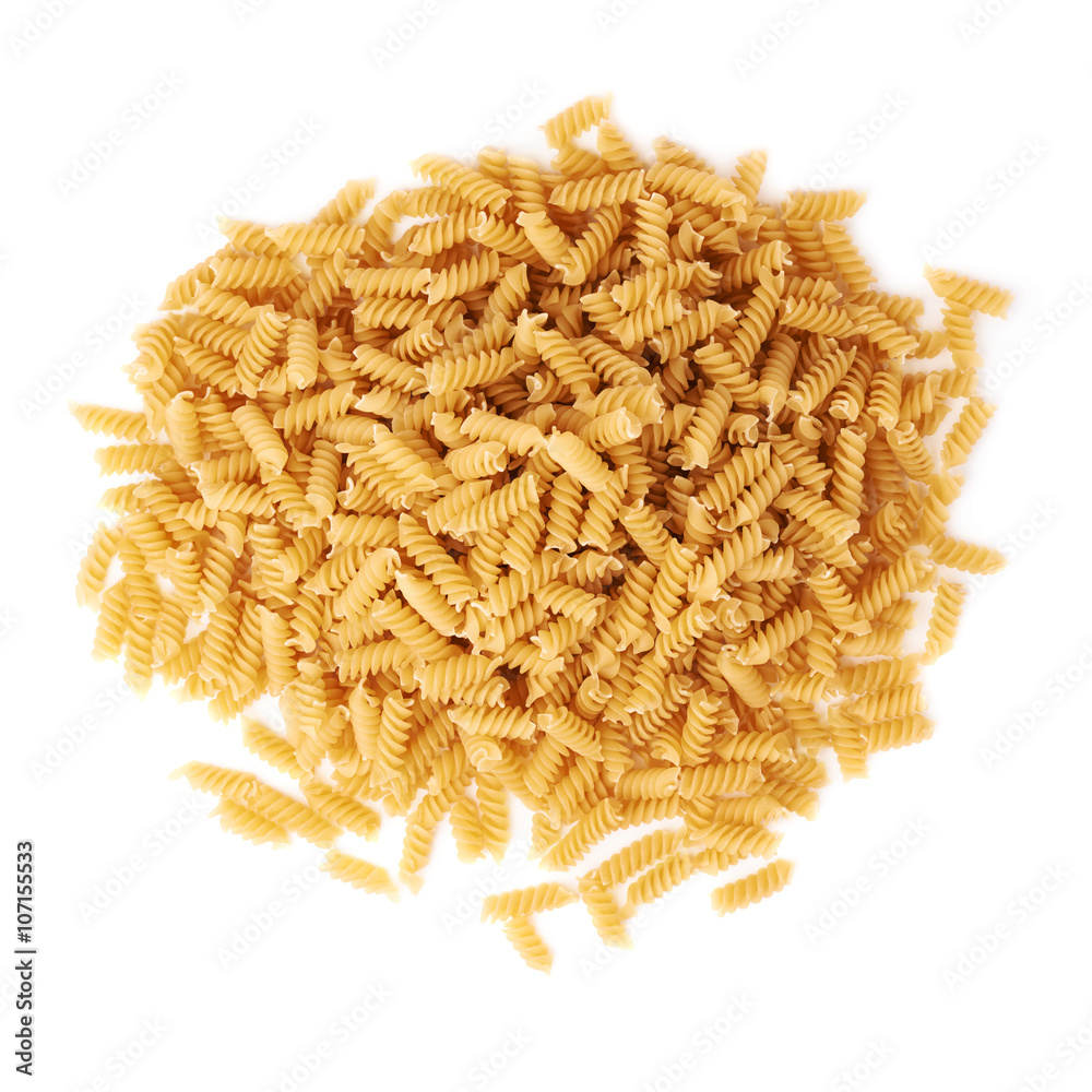 Pile of dry rotini pasta over isolated white background Pile of dry rotini pasta over isolated white background