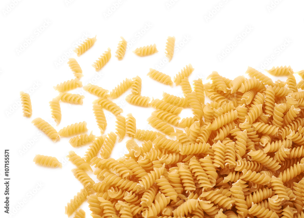Pile of dry rotini pasta over isolated white background Pile of dry rotini pasta over isolated white background