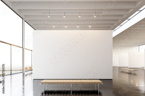 Picture exposition modern gallery,open space.Blank white empty canvas hanging contemporary art museum.Interior loft style concrete floor,light spots,generic design furniture and building.3d rendering photo