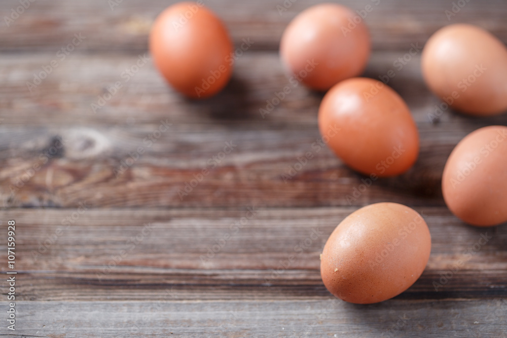 Brown eggs on a rustic wooden table Brown eggs on a rustic wooden table