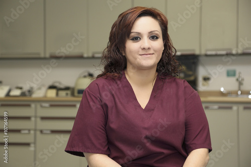 Young attractive female nurse inside medical clinic