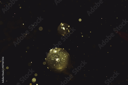 golden particles abstract dark background