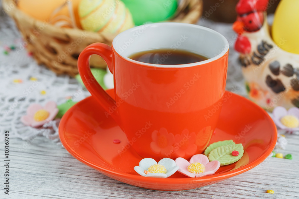 Table setting for Easter - Easter cakes, coffee cup and colored