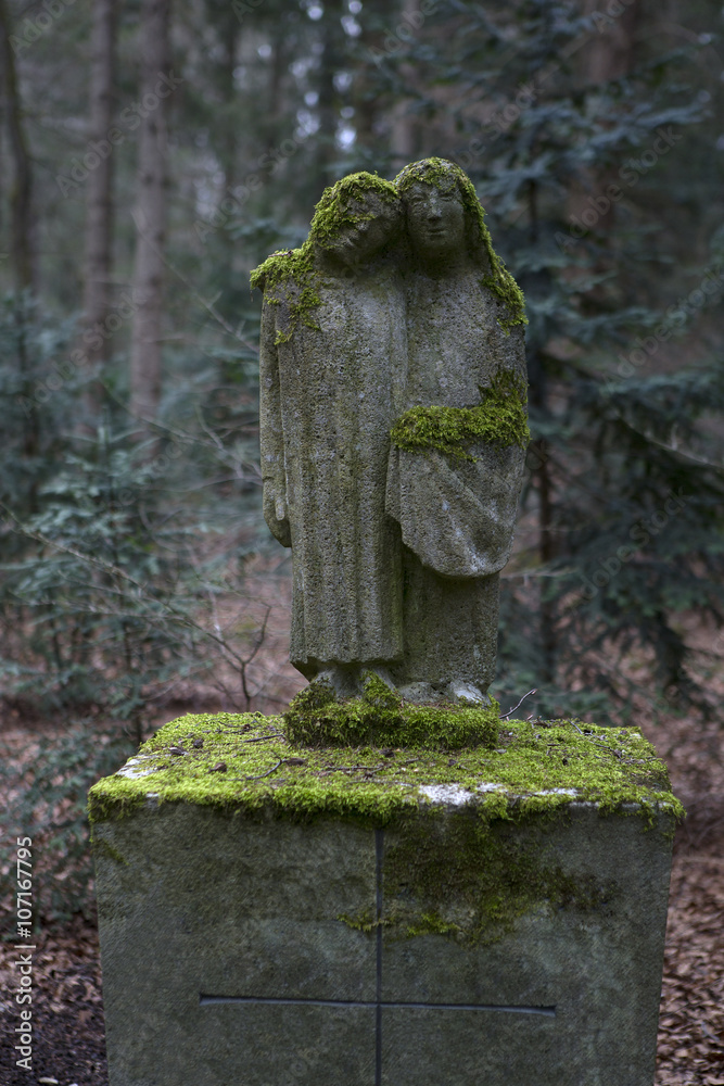 Overgrown grave stones