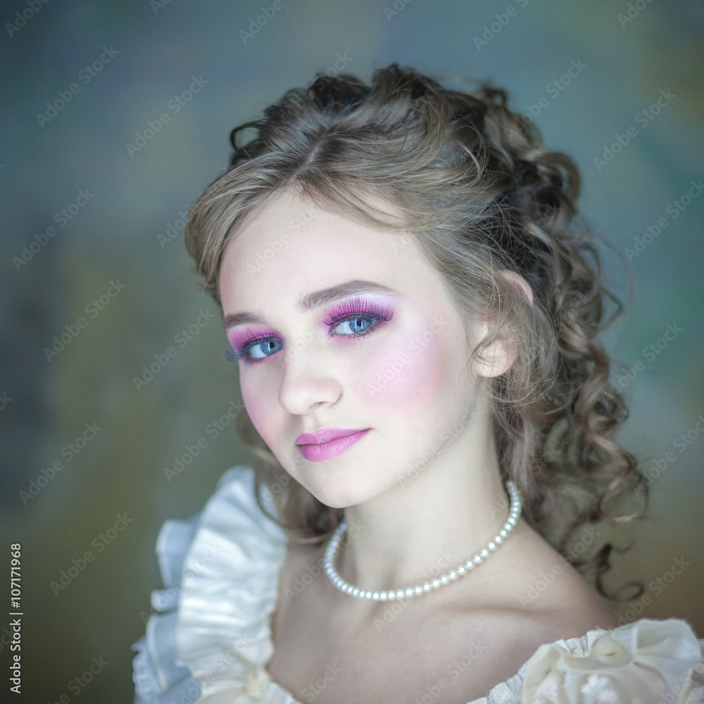 Little girl with beautiful makeup. Little girl in a vintage dress