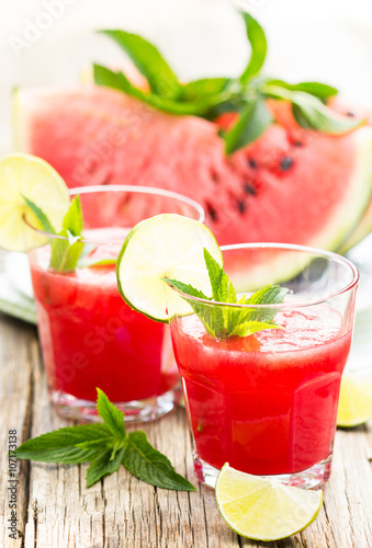 Watermelon juices with lime and mint in the glass