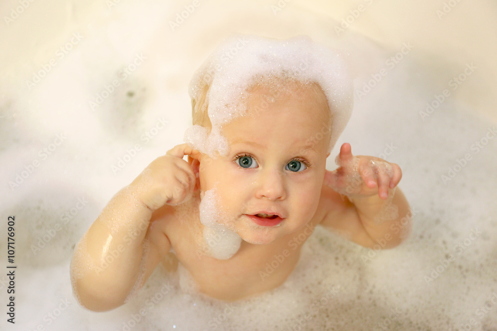 Baby Covered in Soap in Bubble Bath Stock Photo | Adobe Stock
