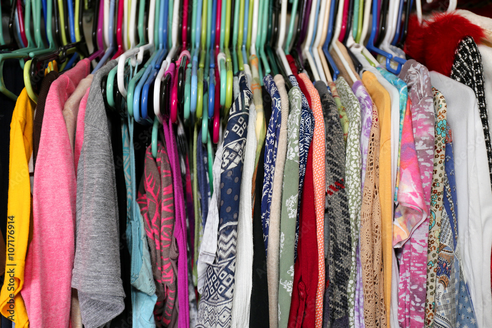 Colorful Woman's Clothing Hanging in a Messy Closet