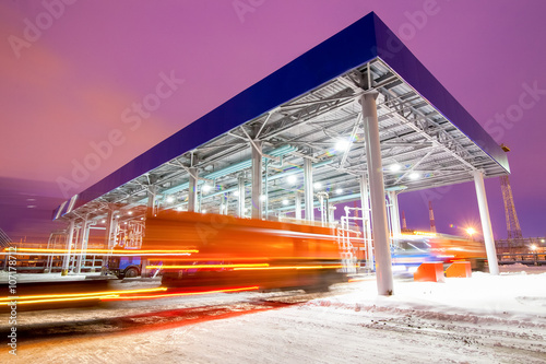 gas station at oil refinery factory night time photo