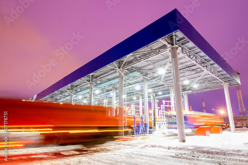 gas station at oil refinery factory night time