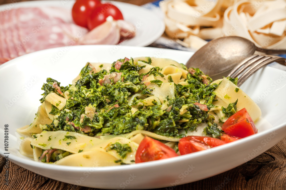 Spaghetti with spinach and bacon. Spaghetti with spinach and bacon.