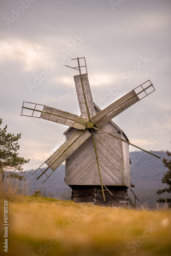 Old wooden windmill with sky and foreground