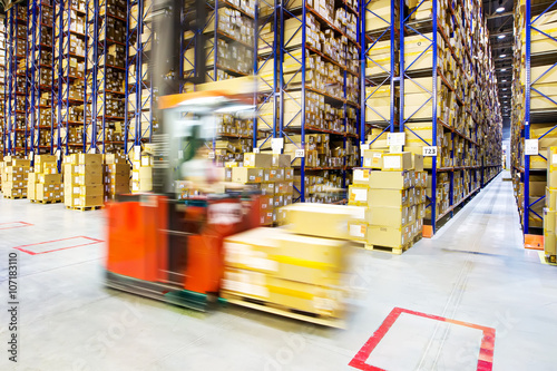 Large modern warehouse with forklifts