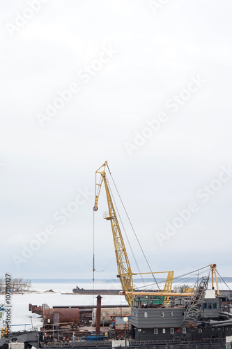 Cheboksary, Russia - April 2, 2016: floating crane in the river port in winter