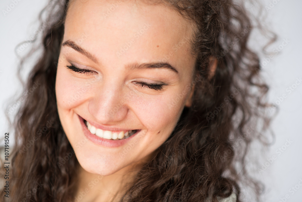 Happy smiling young woman face with closed eyes.Close-up portrait Happy smiling young woman face with closed eyes.Close-up portrait