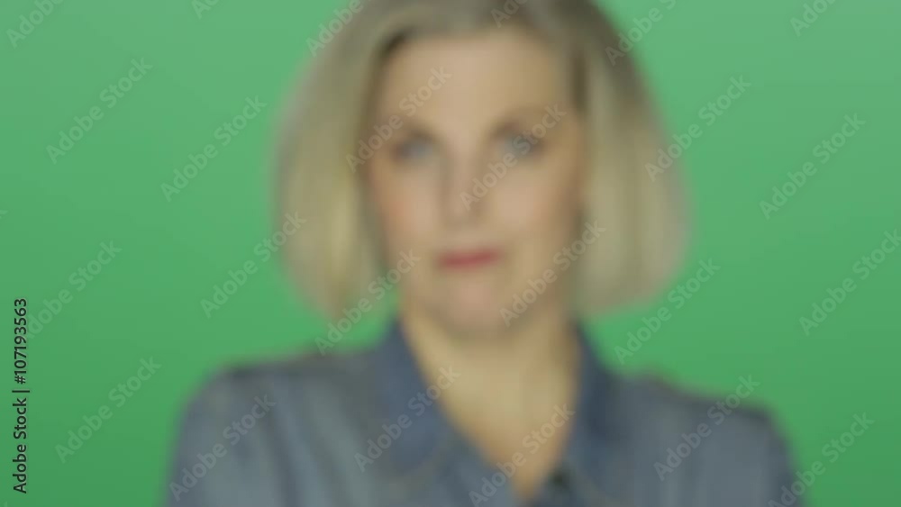 Beautiful older woman showing an array of emotions, on a green screen studio background Beautiful older woman showing an array of emotions, on a green screen studio background