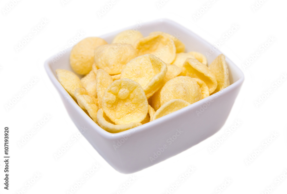 Potato snacks on a square bowl on white background Potato snacks on a square bowl on white background
