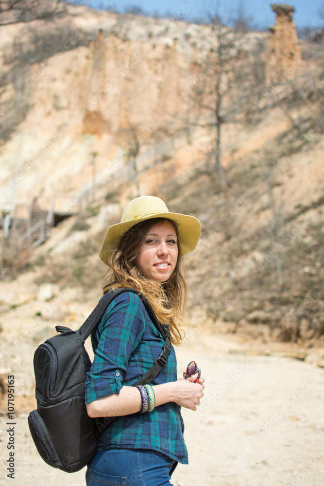 Woman hiker with backpack outdoors