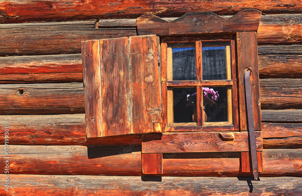 window with shutters in a wooden house