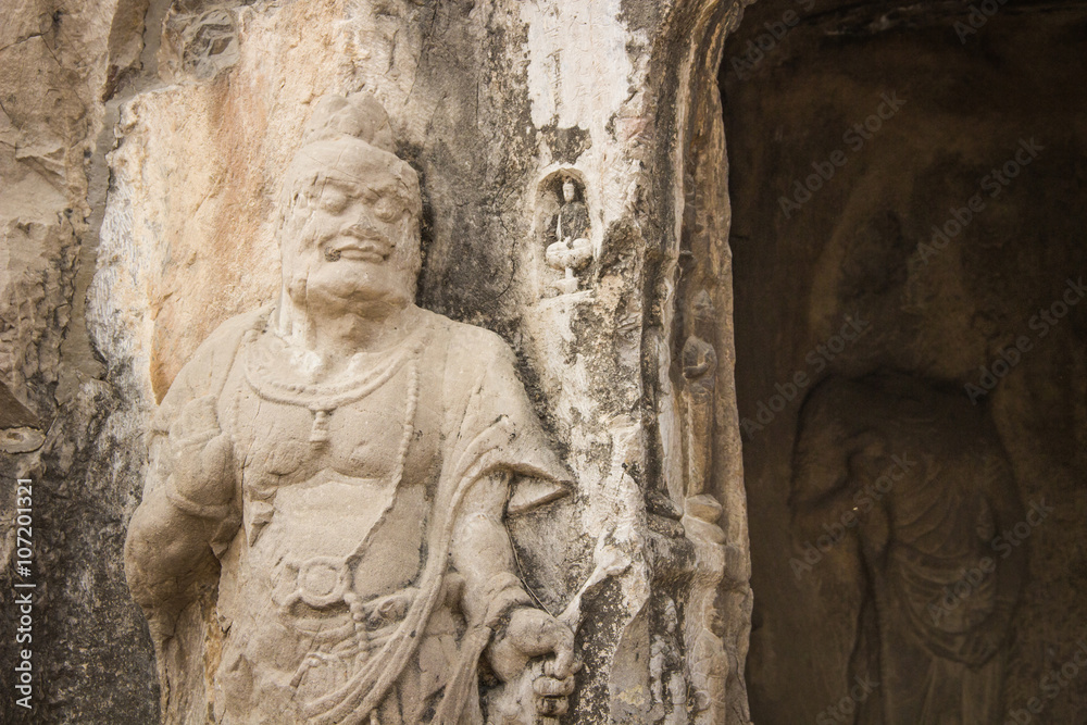 Porter's statue rock carving at Longmen Grottoes, Luoyang , Hena