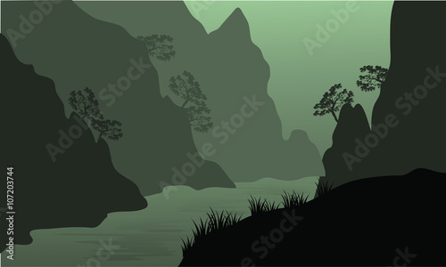 Silhouette of river between the cliffs
