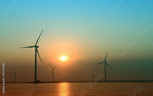 Wind power, in the sea of the sunset