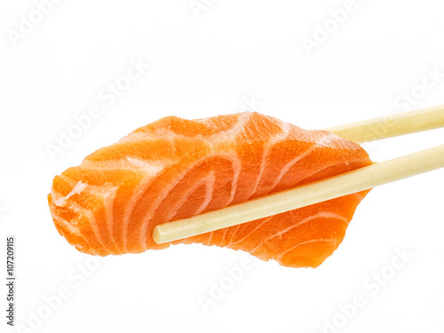Salmon sushi with chopsticks shot on white