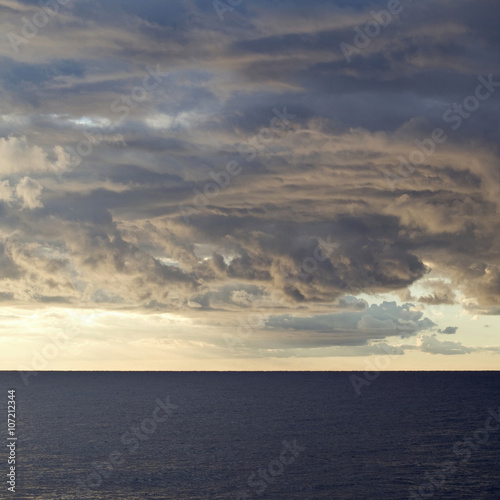 Dark cumulus clouds hovering over the sea © Dmytro Surkov