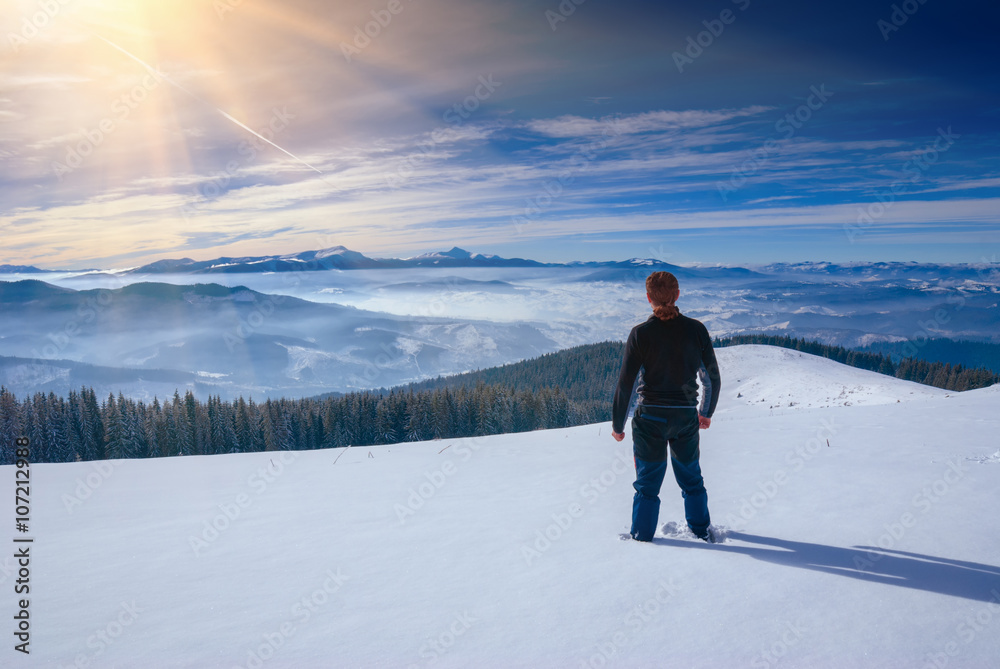 Hiker stays in a Carpathian mountain valley