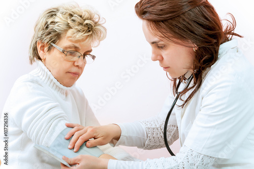 Doctor examining a child in a hospital photo