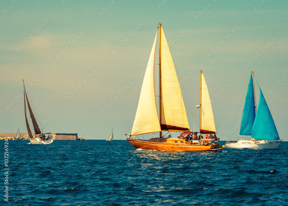 Yachts sailing of the sea. Nautical landscape with sailboats - cruising yacht in regatta race.