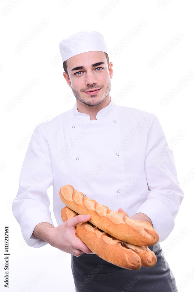 young baker isolated on white studio background holding a traditional bread french baguettes young baker isolated on white studio background holding a traditional bread french baguettes