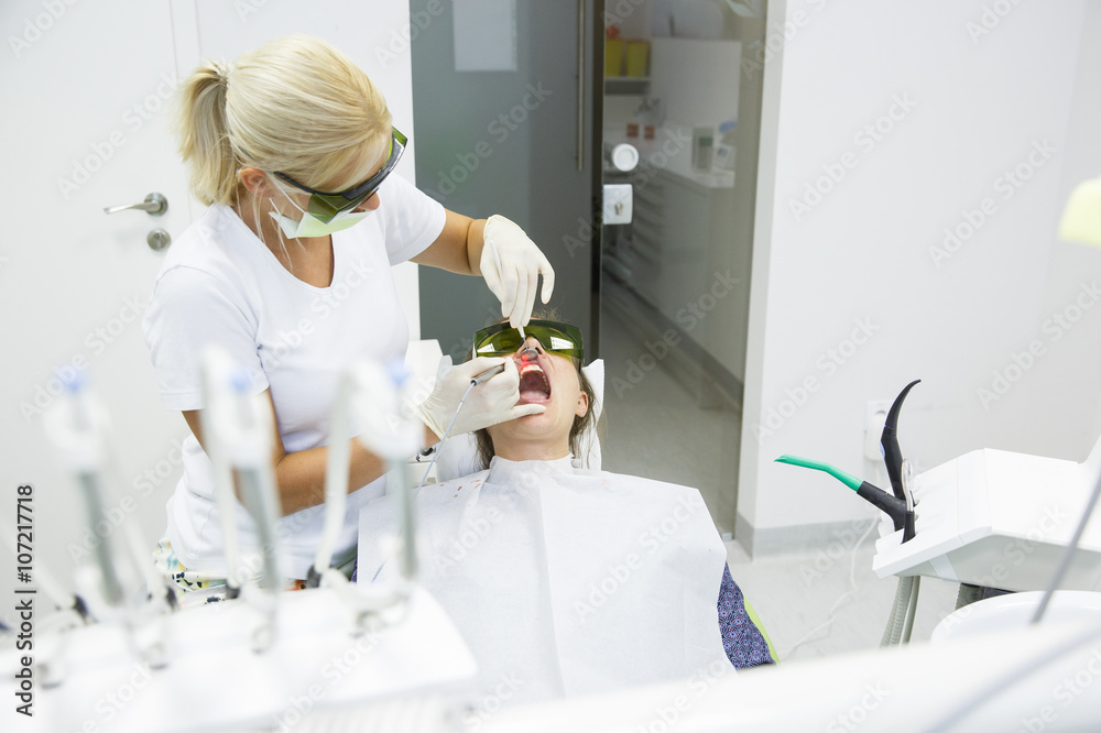 Dentist using a modern diode dental laser