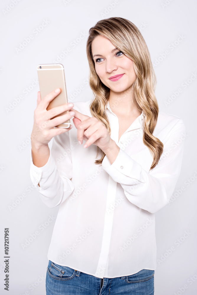 Casual pretty woman taking a selfie Casual pretty woman taking a selfie